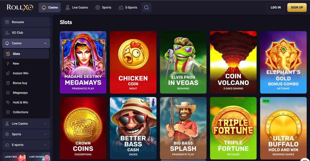 RollXO slots lobby showing Madame Destiny Megaways from Pragmatic Play, Chicken Coin from InOut, Elvis Frog in Vegas from BGaming, Coin Volcano from 3 Oaks Gaming, Elephant's Gold Bonus Combo from NetGame, Crown Coins from Endorphina, Better Bass Cash, Big Bass Splash, Triple Fortune and Ultra Buffalo Hold and Win