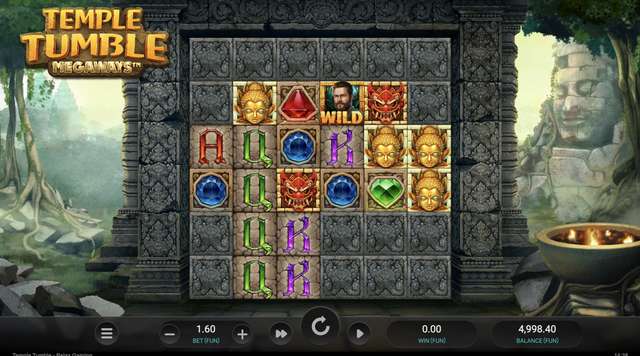 Temple Tumble Megaways base reels with the 6x6 Megaways grid, tiki-god high-pay symbols on the top row, and WILD and gem symbols across the middle